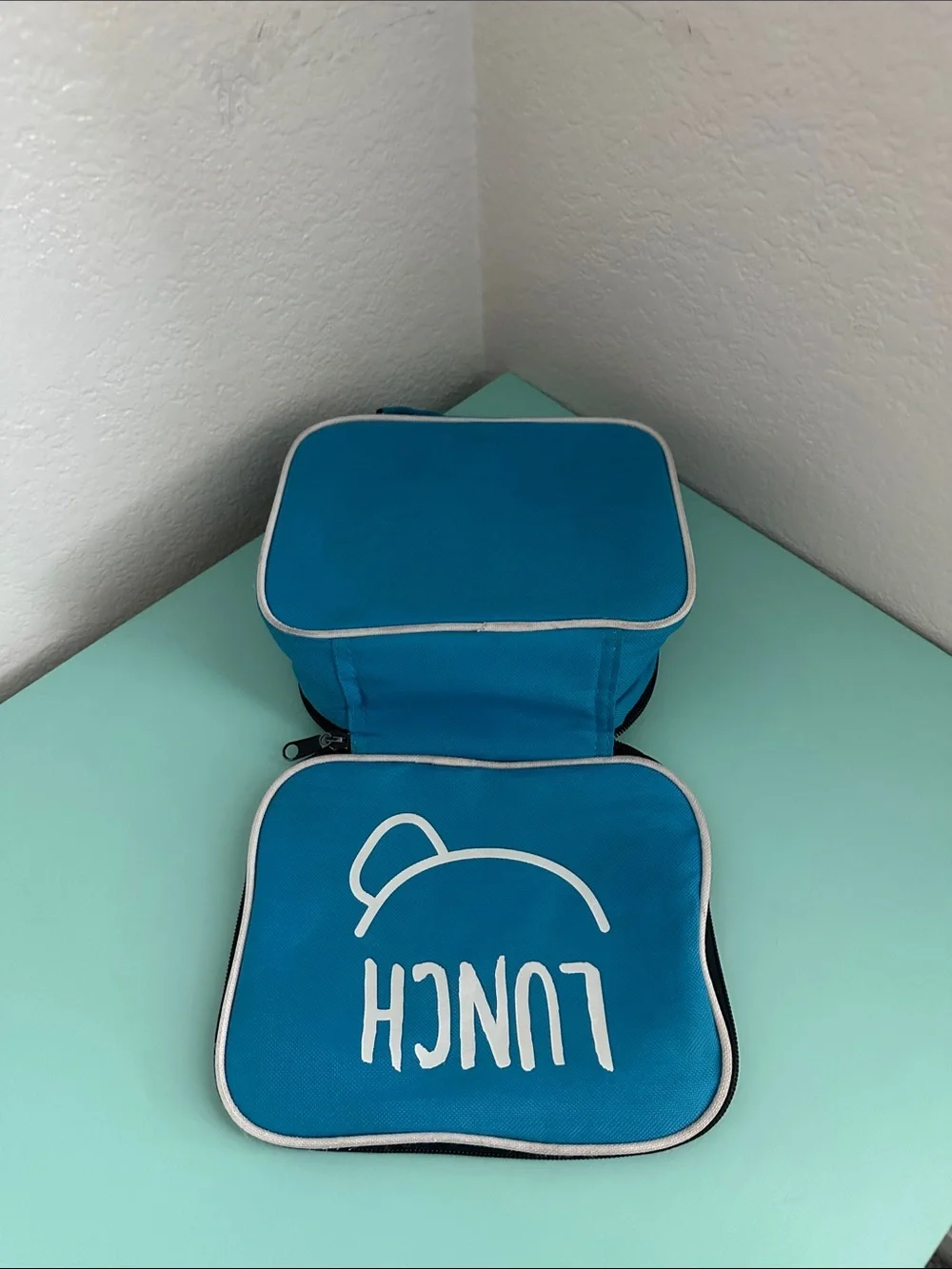 Walmart blue insulated lunch box with a minimalist white ’LUNCH’ graphic-used